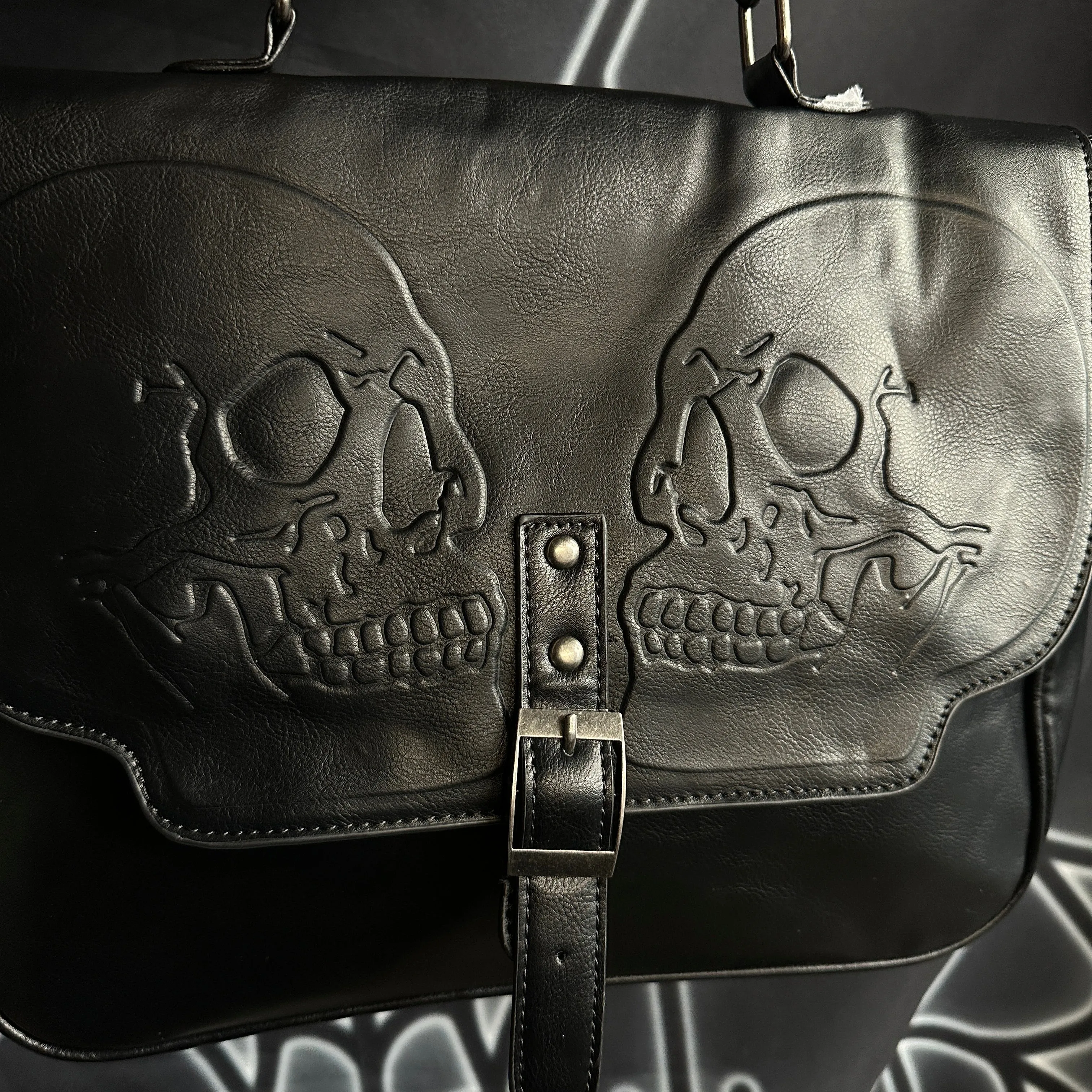 Embossed Twin Skull Satchel